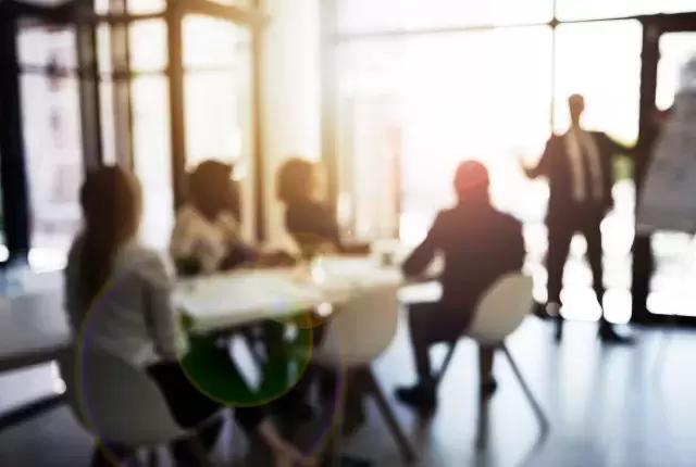 Shot of a group of business colleagues talking together during a meeting in a boardroom