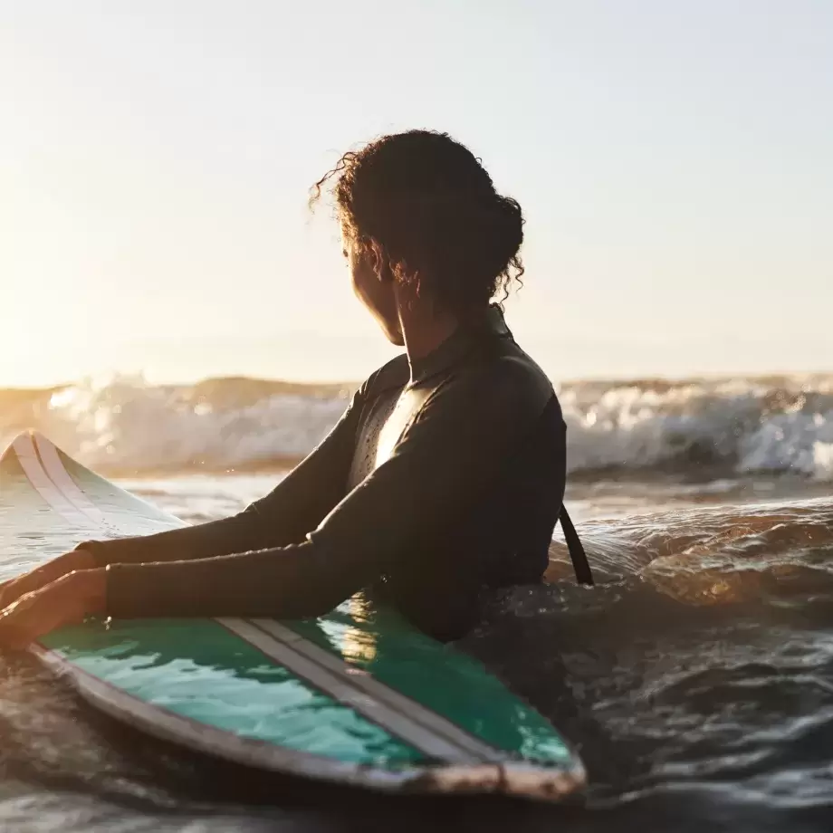 A female surfer waiting for a wave